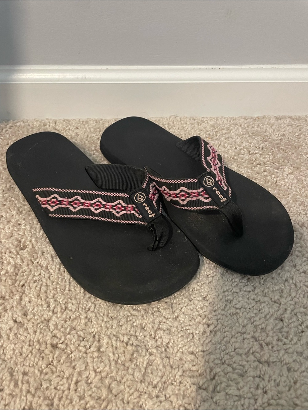 Reef Women’s Black Flip-Flops with Pink Patterned Straps